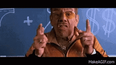 Man Pointing At Blackboard With Dollar Signs GIF