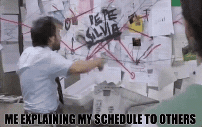 Man Pointing At Bulletin Board Saying Me Explaining My Schedule GIF
