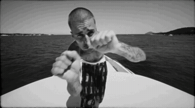 Man Pointing At Camera On Boat GIF