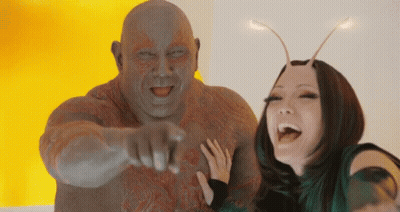 Man Pointing At Camera Posing With Woman GIF