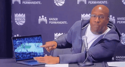 Man Pointing At Laptop At Kaiser Permanente Sign GIF