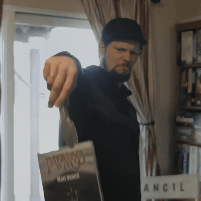 Man Pointing At Pwnso Book GIF