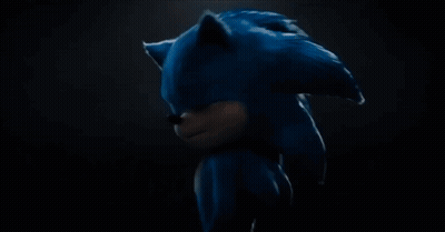 Man Pointing At Red Brick Wall GIF