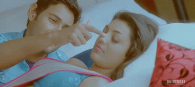 Man Pointing at Woman's Nose With Universal Logo