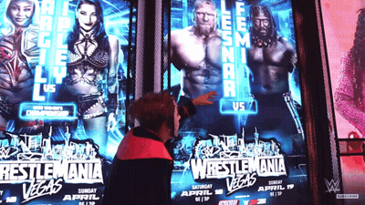 Man Pointing At Wrestlemania Poster In Las Vegas GIF