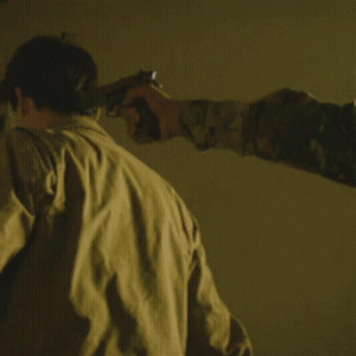 Man Pointing Gun At Another Man By Window GIF