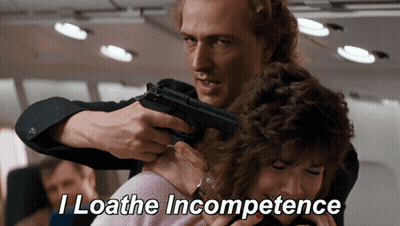 Man Pointing Gun At Woman Loathing Incompetence GIF