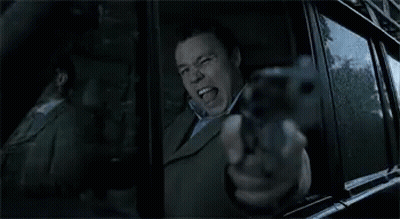 Man Pointing Gun Out Car Window GIF