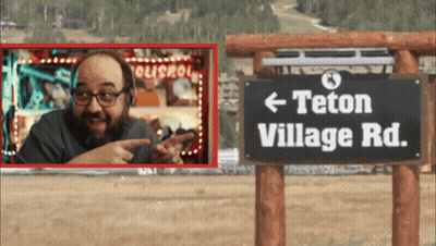 Man Points To Sign Saying Teton Village Road GIF