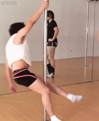 Man Pole Dancing In Front Of Mirror As Woman Watches GIF