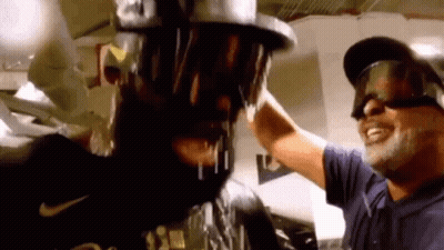Man Pouring Beer On Another Man's Head Wearing Goggles GIF