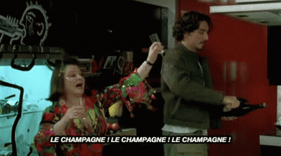 Man Pouring Champagne As Woman Holds Glass GIF