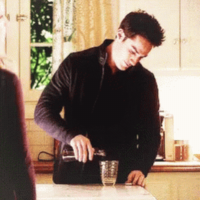 Man Pouring Drink Into Glass GIF