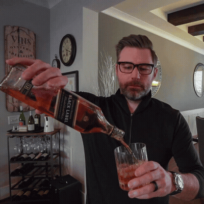 Man Pouring Glass Of Black Label Whisky GIF