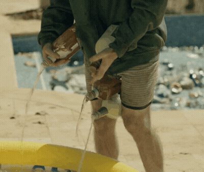 Man Pouring Liquid Into Yellow Pool GIF