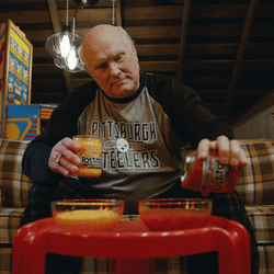 Man Pouring Salsa Into Bowls GIF