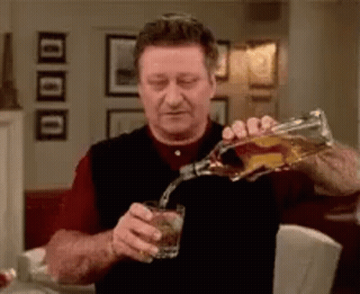 Man Pouring Whiskey Into Glass GIF