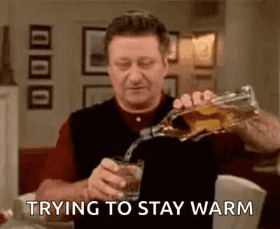 Man Pouring Whiskey Trying To Stay Warm GIF