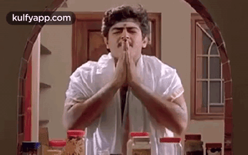 Man Praying In Kitchen GIF