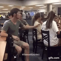 Man Pull Hair Of A Girl Sitting GIF