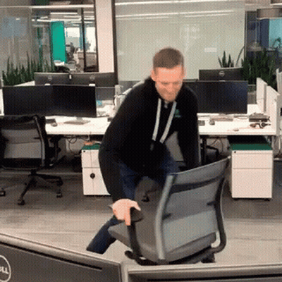 Man Pushing Chair In Office With Dell Monitor GIF