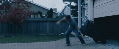 Man Pushing Garbage Can With Letter L GIF