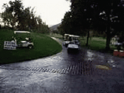Man Pushing Golf Cart Through Mud GIF