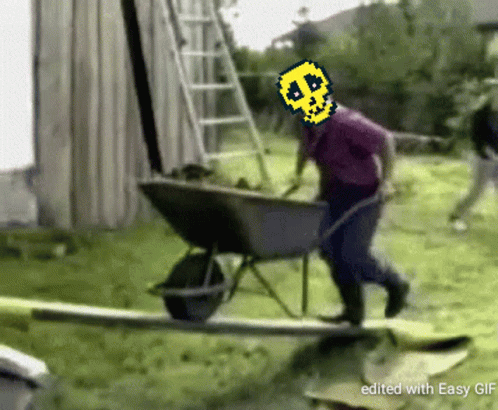 Man Pushing Wheelbarrow With Pixelated Skull On Head GIF