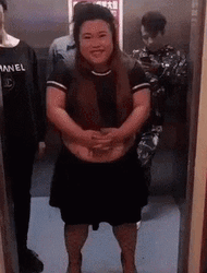 Man Pushing Woman Out Of Elevator GIF