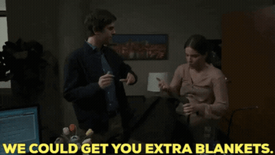 Man Putting Blanket On Woman: We Could Get You Extra Blankets GIF