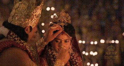 Man Putting Crown On Bride's Head GIF
