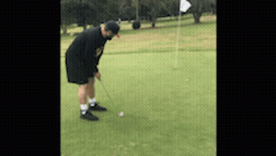 Man Putting Golf Ball On Green GIF