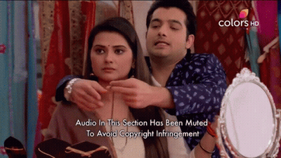 Man Putting Necklace On Woman Audio Muted GIF
