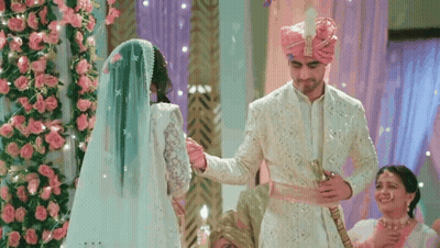 Man Putting Ring On Woman's Finger With The Pursuit Of Love GIF