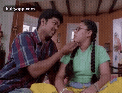 Man Putting Something On Girl's Face GIF