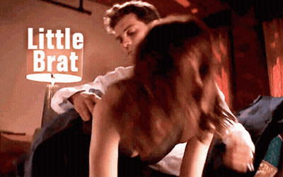 Man Putting Woman On Bed Saying Little Brat GIF