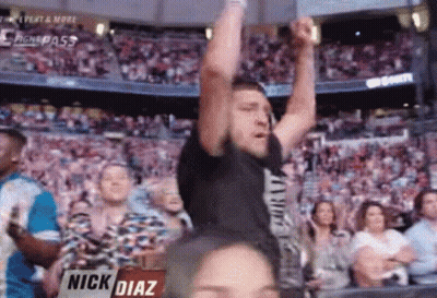 Man Raising Arms At Sports Game GIF