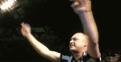 Man Raising Arms In Dark Room GIF