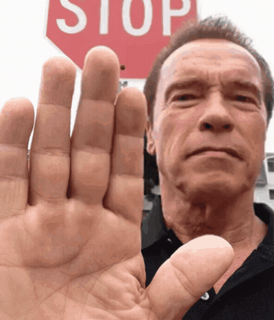 Man Raising Hand At Red Stop Sign GIF