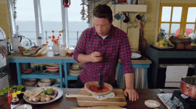 Man Reaching For Crab Legs With Tongs GIF