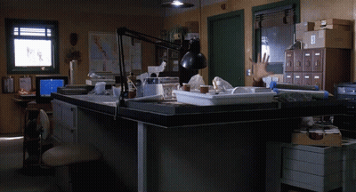 Man Reaching Hand Towards Desk GIF