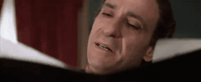 Man Reading Book Eyes Closed Crying GIF