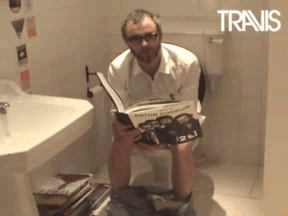 Man Reading Book On Toilet Travis GIF