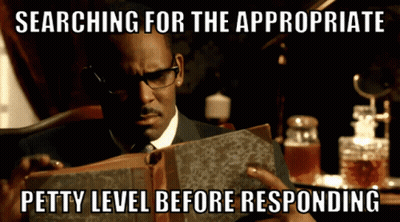 Man Reading Book Searching For The Appropriate Petty Level Before Responding GIF