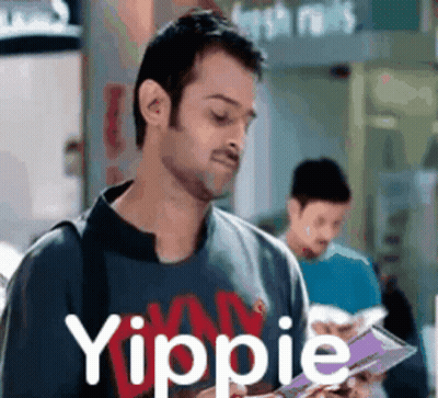 Man Reading Book With Yippie Shirt GIF
