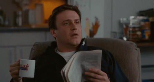 Man Reading Newspaper Holding Coffee GIF
