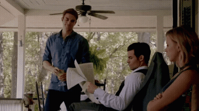 Man Reading Newspaper On Porch GIF