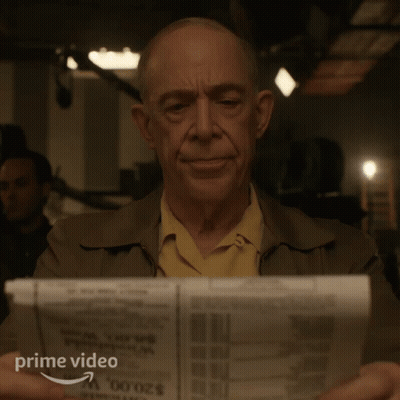 Man Reading Newspaper With Prime Video Logo GIF