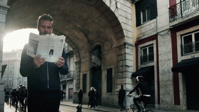 Man Reading Newspaper Woman Riding Bike GIF