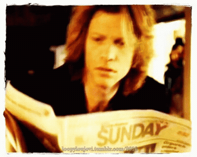 Man Reading Sunday Newspaper